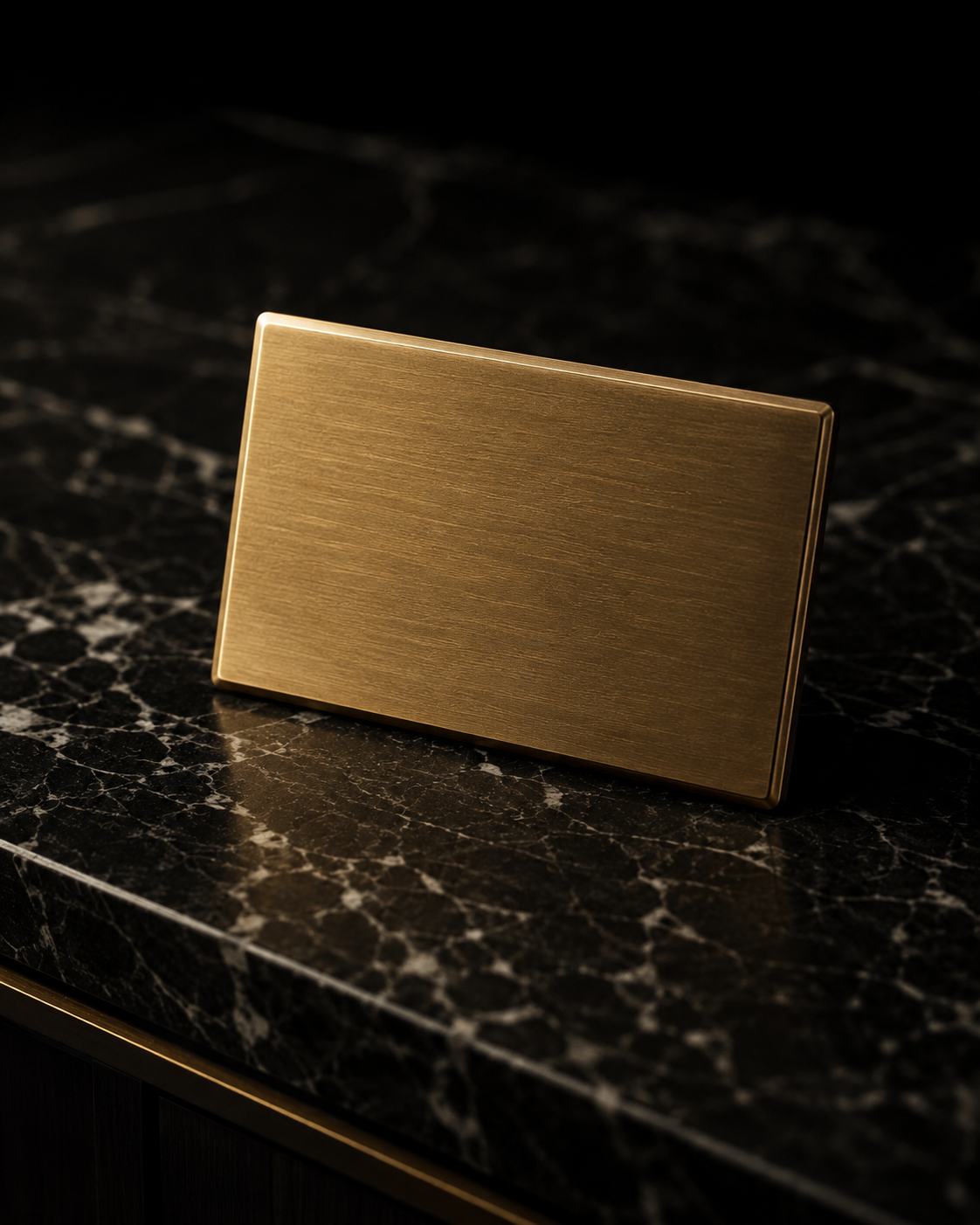 Concept rendering of a brushed-brass Private Client touchpoint resting on dark marble